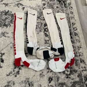 2 pairs of Nike Dri-Fit compression high socks.